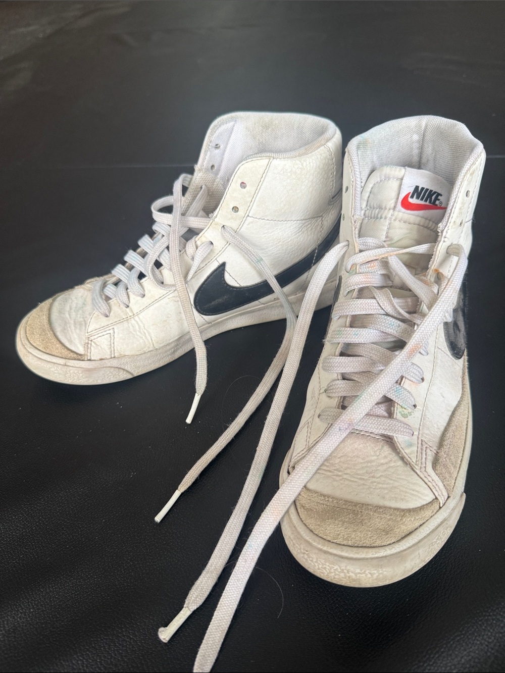 Well loved Nike White High-Top Sneakers with Black Swoosh and red Logo